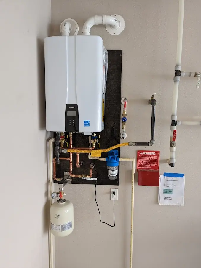 Professional plumber installing copper piping in a Hot Springs home